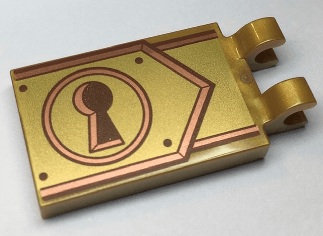 Tile, Modified 2 x 3 with 2 Clips with Reddish Brown Keyhole on Copper and Gold Clasp Pattern